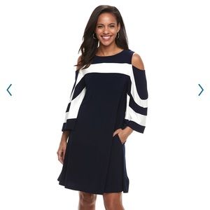 women's Nina Leonard cold-shoulder dress features draped sleeves.